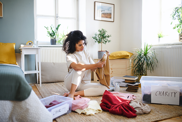 Woman decluttering a room